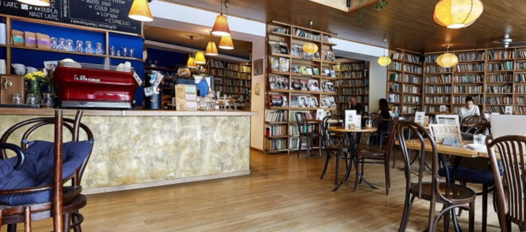 Cozy book café in Budapest with shelves full of books and a relaxed local vibe.