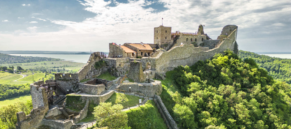 Hilltop ruins of Szigliget Castle with panoramic views over Lake Balaton and the volcanic hills of the Balaton Uplands.